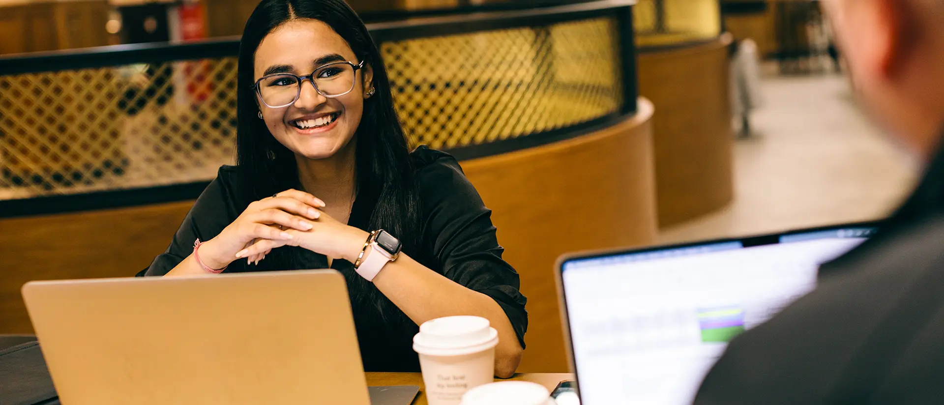 Smiling student with laptop